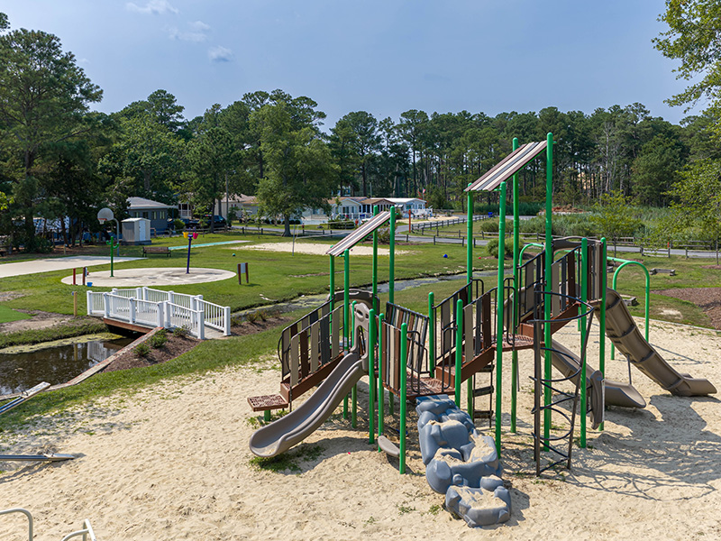 playground-splash-pad--courts Children's playground and splash pad beside the basketball courts