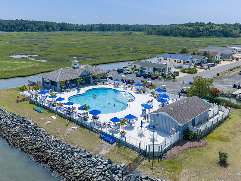 resortstyle-pool Outdoor swimming pool and sundeck lined with lounge chairs