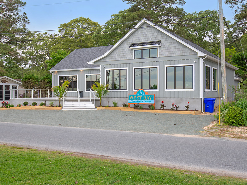 the-community-center The West Bay community center building with its entrance and lawn